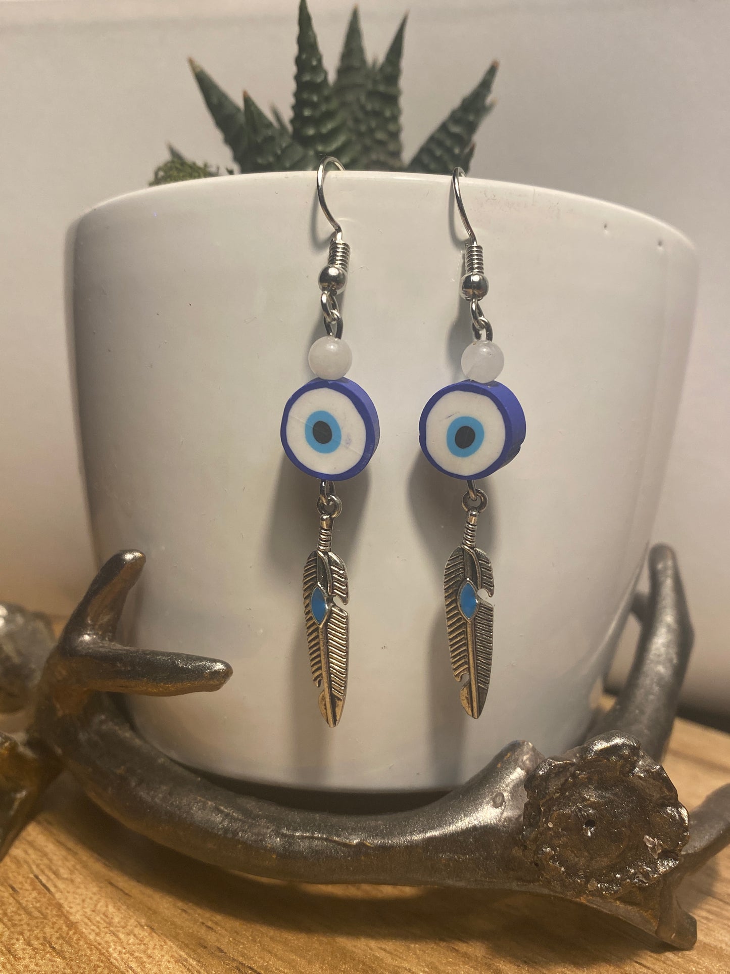 Evil eye with feather dangle earrings