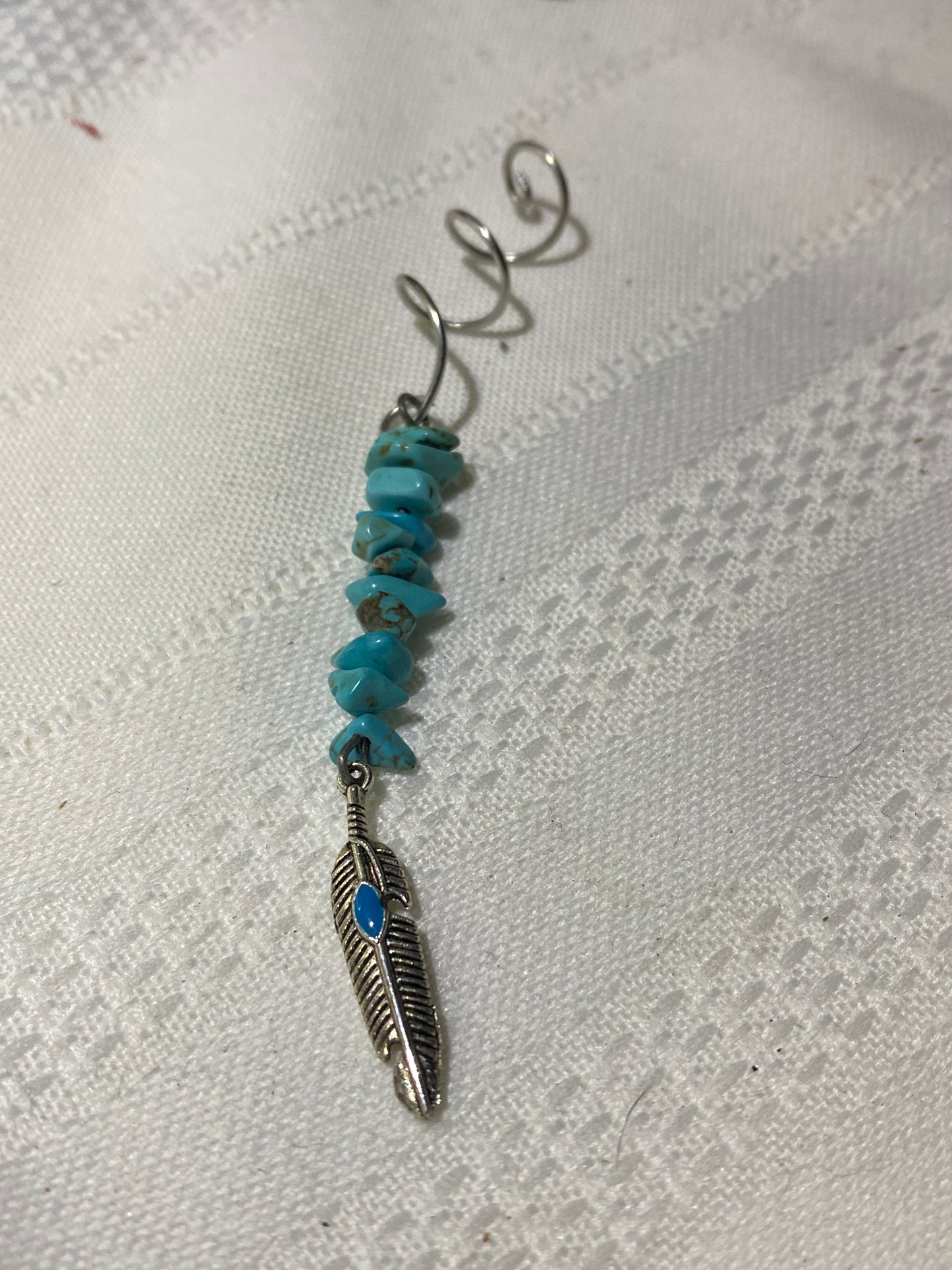 Turquoise Hair twist with feather accent